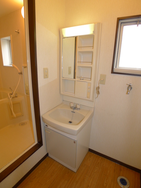 Washroom. It has a small window in the dressing room space