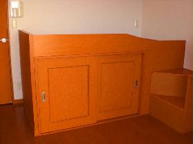 Living and room. Bet with rooms. Under bet, It has become a storage space. 