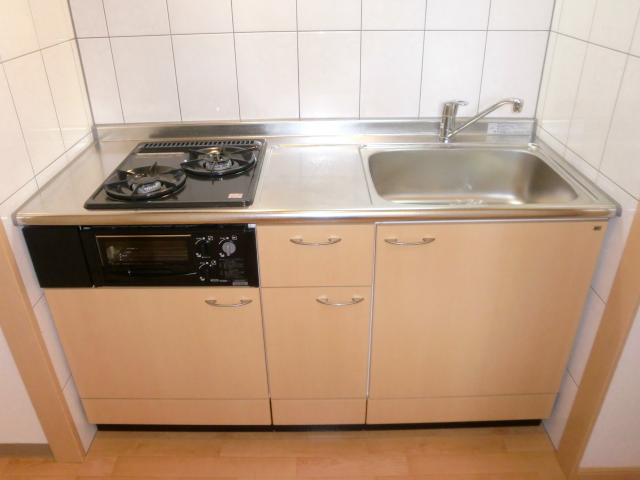 Kitchen. Also it comes with a two-burner gas stove with grill