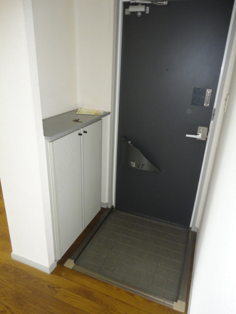 Entrance. With a convenient cupboard