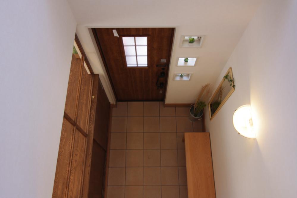 Entrance. It overlooks the entrance from the second floor of the atrium.