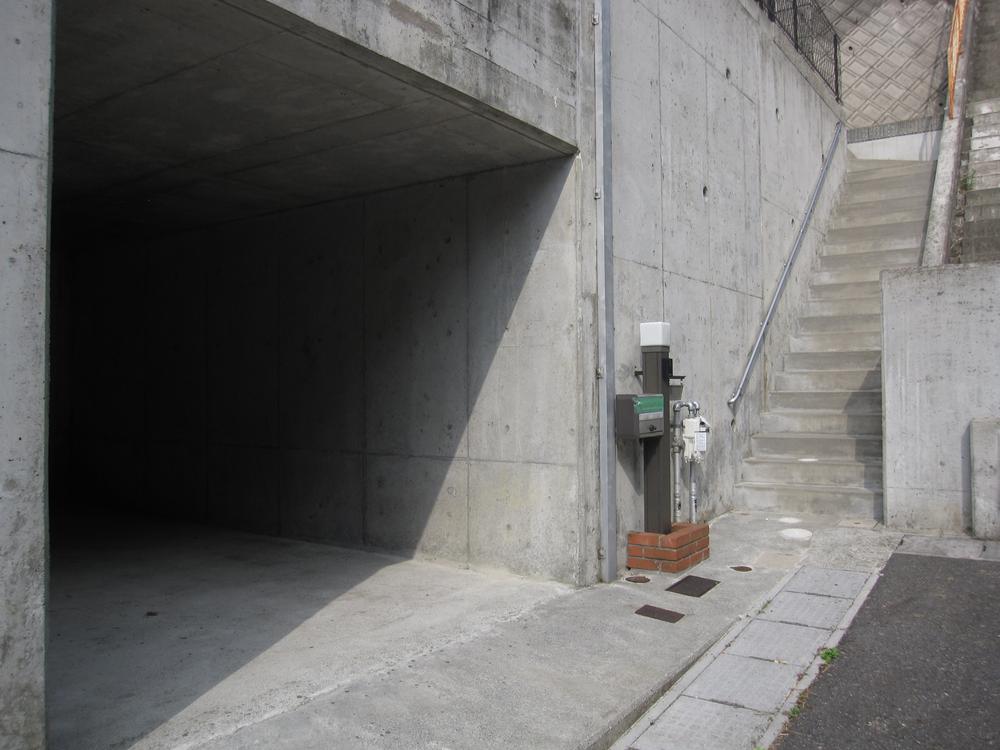 Parking lot. To the front door and go up the right stairs