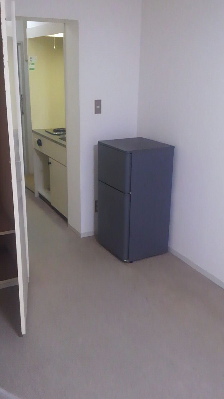 Living and room. There is a refrigerator