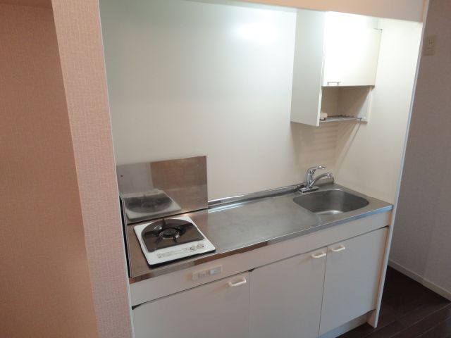 Kitchen. Storage rack on the sink is useful!