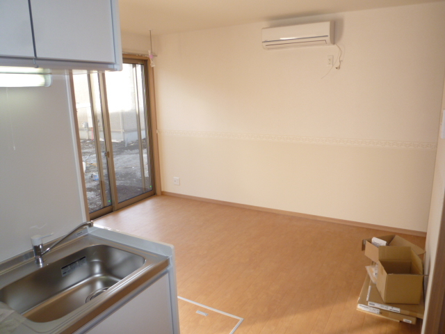 Living and room. It is a photograph of the same type