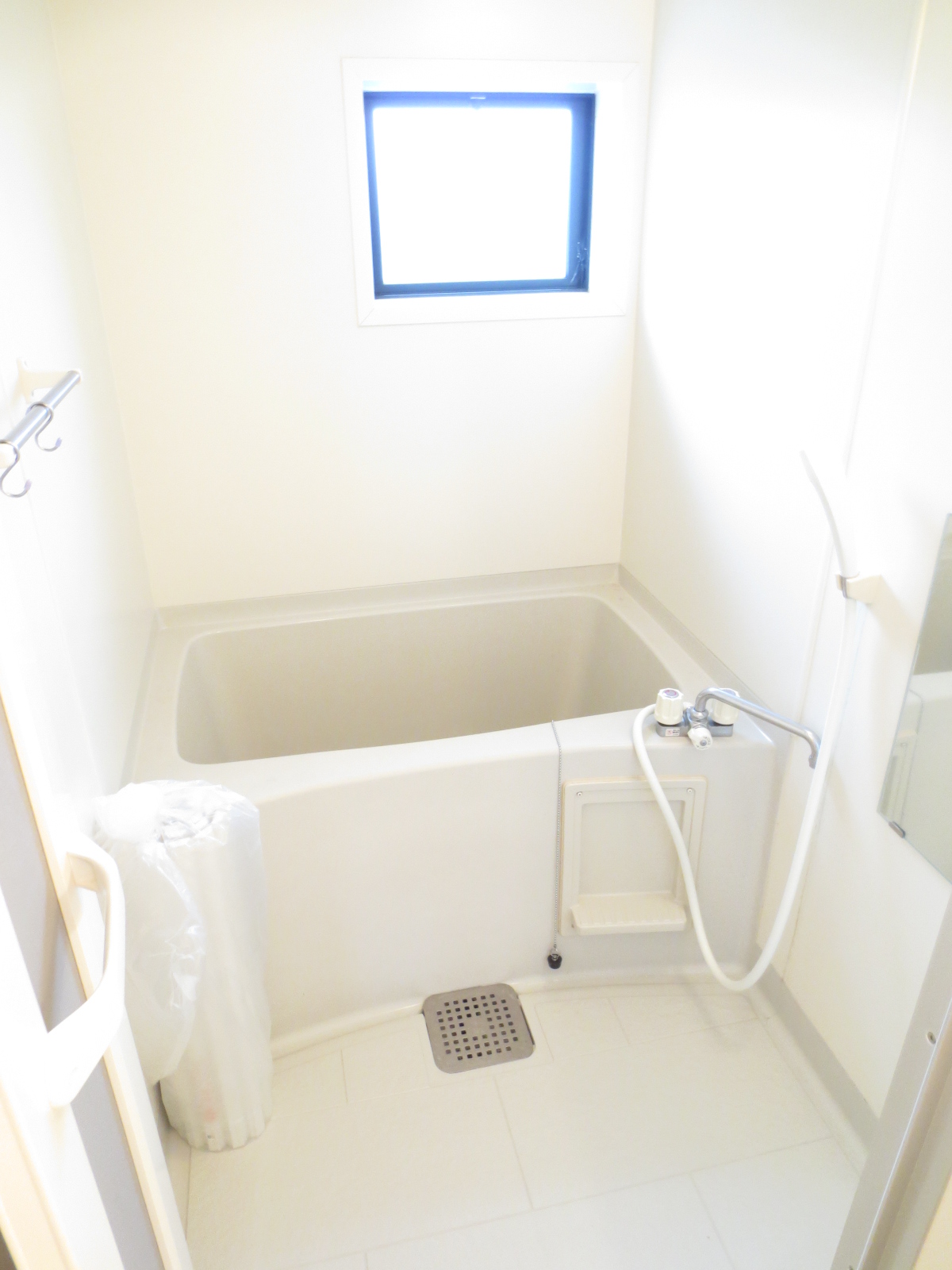 Bath. It is a simple bathroom.