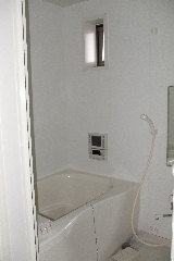 Bath. Bathroom with small window.