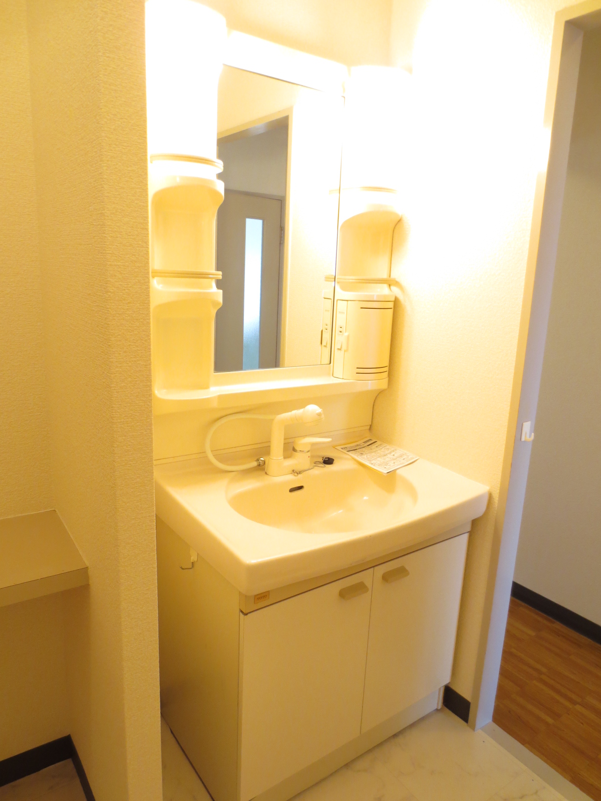 Washroom. It is a wash basin with a shower! There is also a washing machine yard!