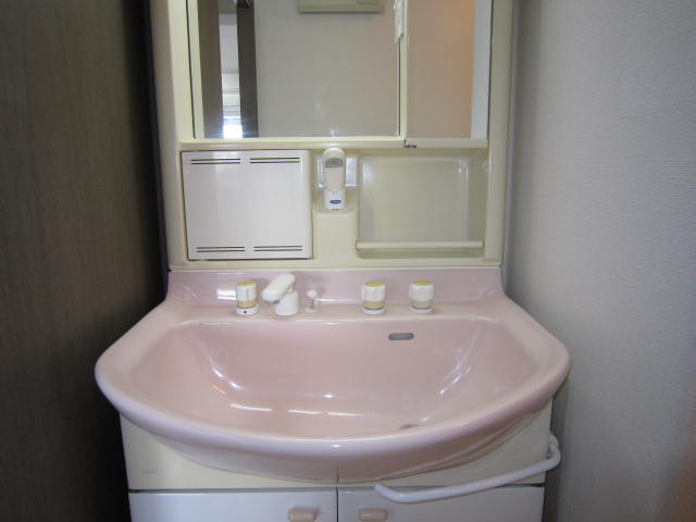 Washroom. It is a handy shower type of faucet to get dressed.