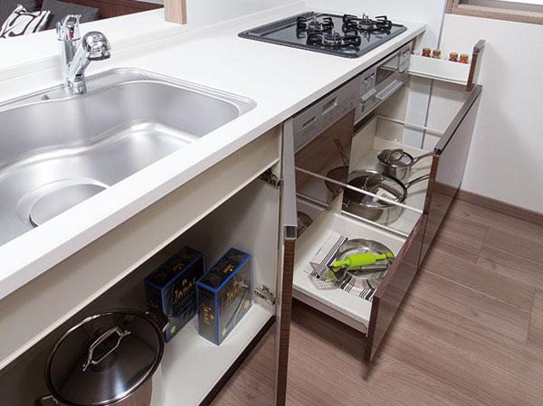 Kitchen.  [Slide cabinet & open door] Gas stove under the, Adopt a large-capacity sliding a large pot can be effortlessly out. Under the sink is, Also it has become a convenient open door to the storage of tall pot.