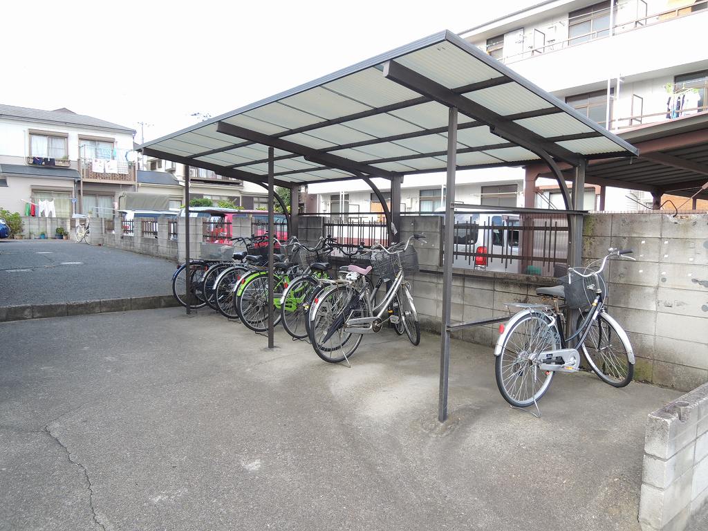 Other common areas. Bicycle-parking space. Back parking lot dirt bike storage.