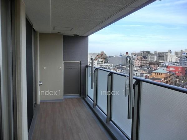 Balcony. Spacious balcony stylish wood deck!