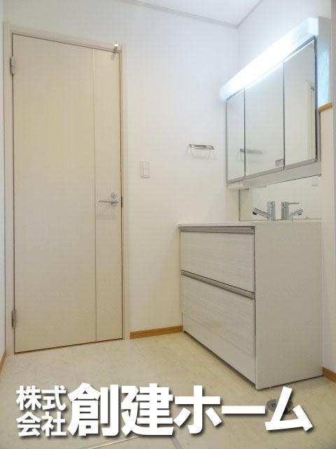 Wash basin, toilet. Bright wash room