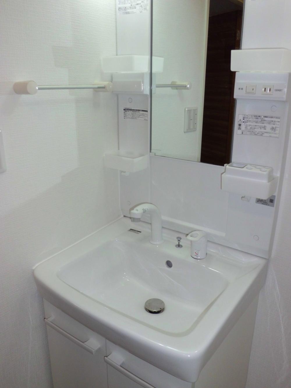 Wash basin, toilet. Bathroom vanity