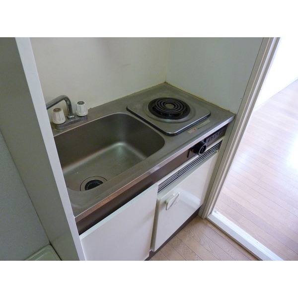 Other. A kitchen with a refrigerator