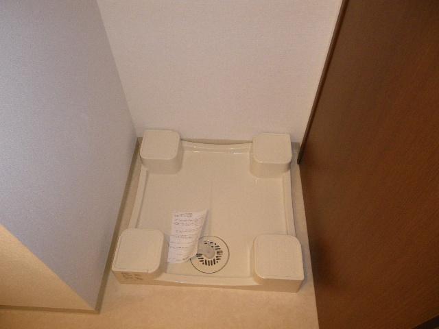 Washroom. Washing machine in the room