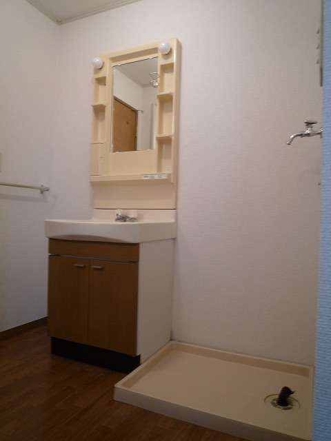 Washroom. Washing machine in the room with a waterproof bread