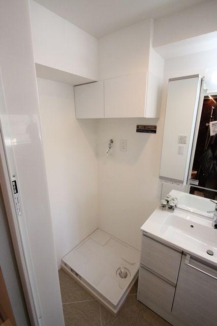 Wash basin, toilet. Washing machine Storage