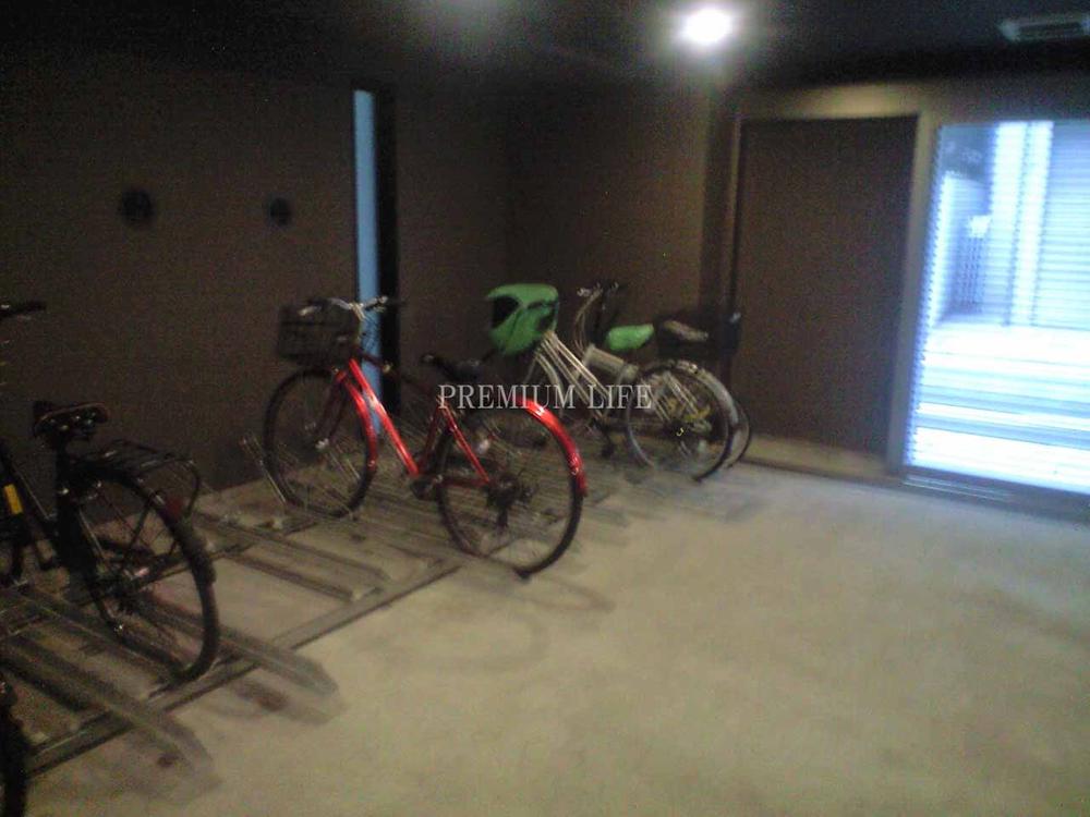 Parking lot.  [Bicycle-parking space] We in good management.