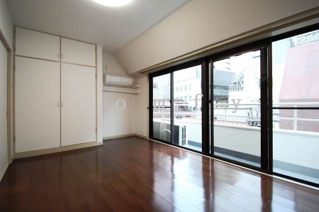 Other room space. The window is large, bright bedroom