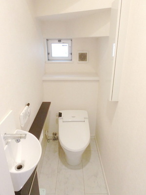 Toilet. Toilet is equipped with Washlet