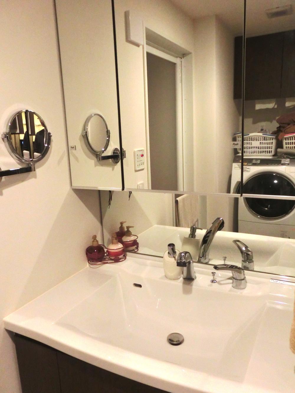 Wash basin, toilet. Wash basin with a magnifying glass