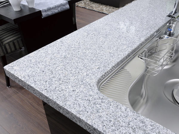 Kitchen.  [Natural stone counter] Adopt a system kitchen was also expressed beauty of an interior. Top plate decorated with natural stone, It enhances the feeling of luxury and functionality.