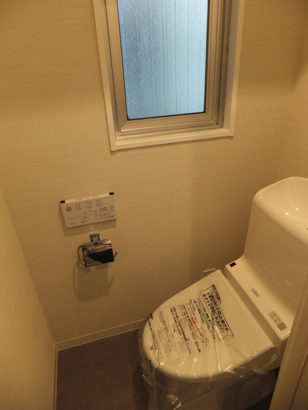 Toilet. Window with toilet