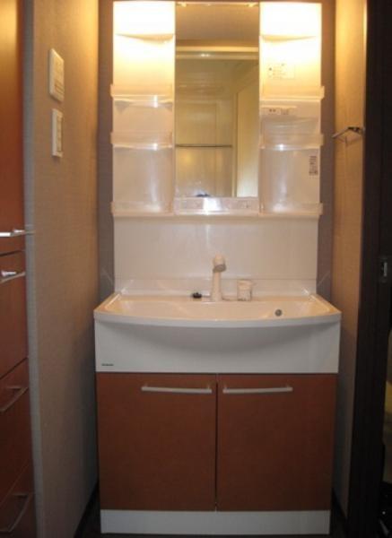 Wash basin, toilet. Another dwelling unit