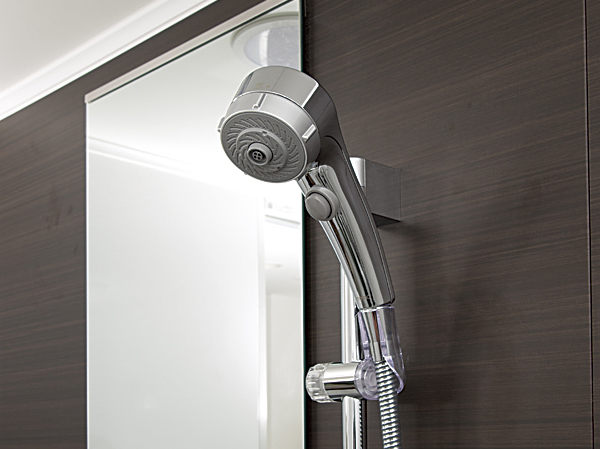 Bathing-wash room.  [Water-saving shower head] You can only be in the water stop pressing the button while in use.