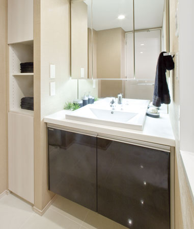 Bathing-wash room.  [Powder Room] 3-surface mirror type of vanity is storage capacity full. The floor is tiled. It is functional, high-quality powder room.