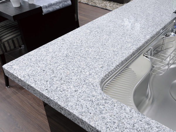 Kitchen.  [Natural stone counter] Adopt a system kitchen was also expressed beauty of an interior. Top plate decorated with natural stone, It enhances the feeling of luxury and functionality.