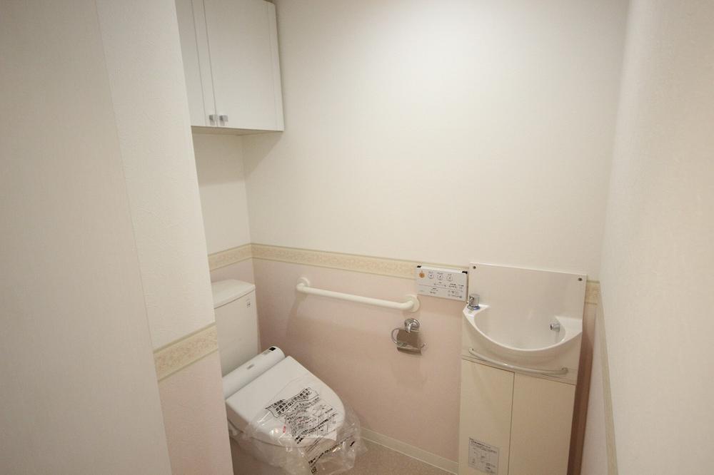 Toilet. Toilet also has a storage space,