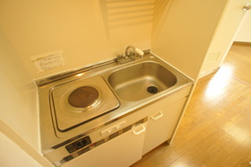 Kitchen. It is a kitchen with a electric stove