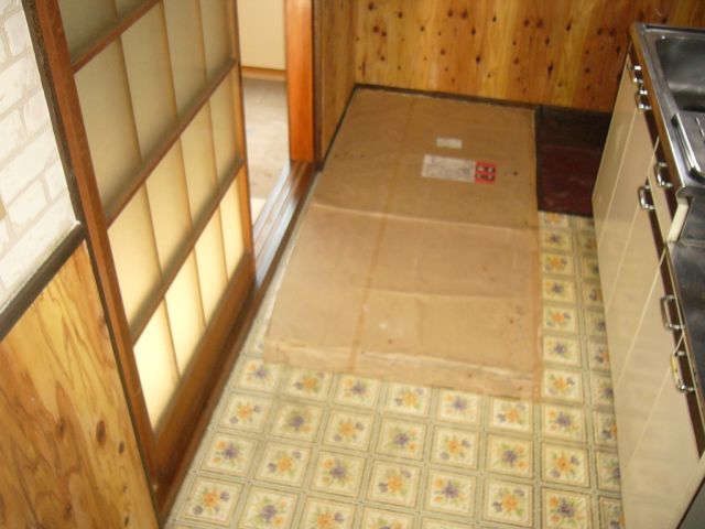 Kitchen. Also Laundry Area, There in the room.