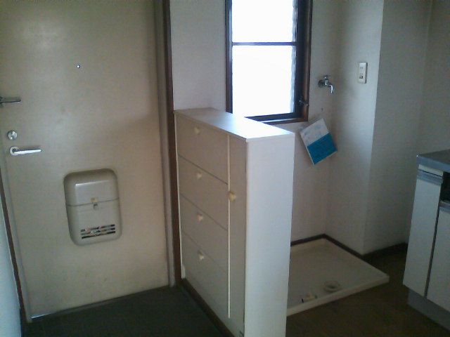 Entrance. There are also windows in front of the washing machine Storage.