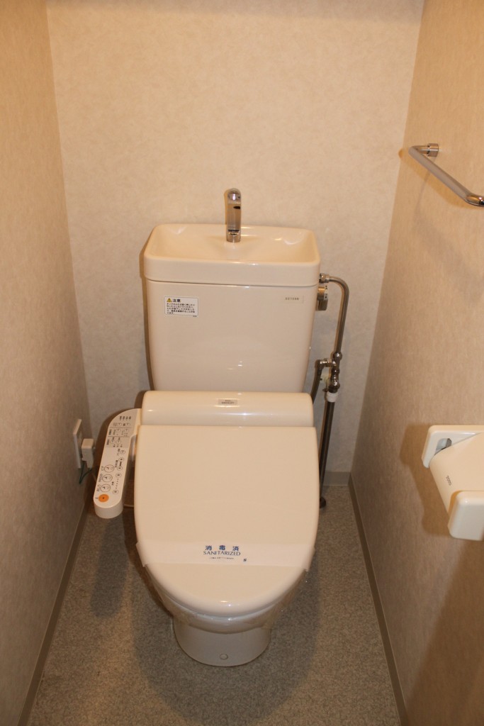 Toilet. Warm water washing toilet seat equipped