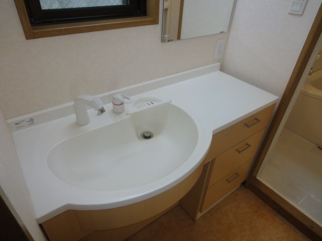 Washroom. Wide is a wash basin.