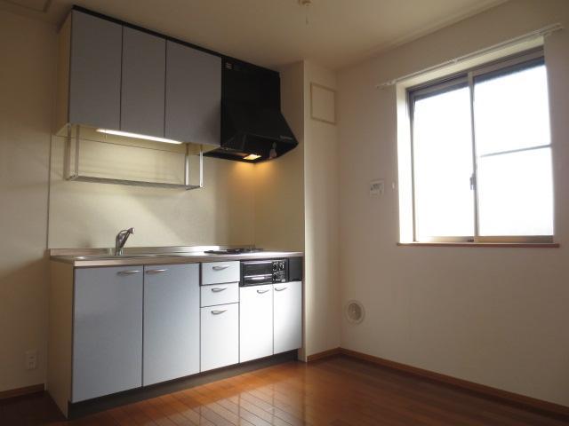 Living and room. There is a window is light and airy in the kitchen