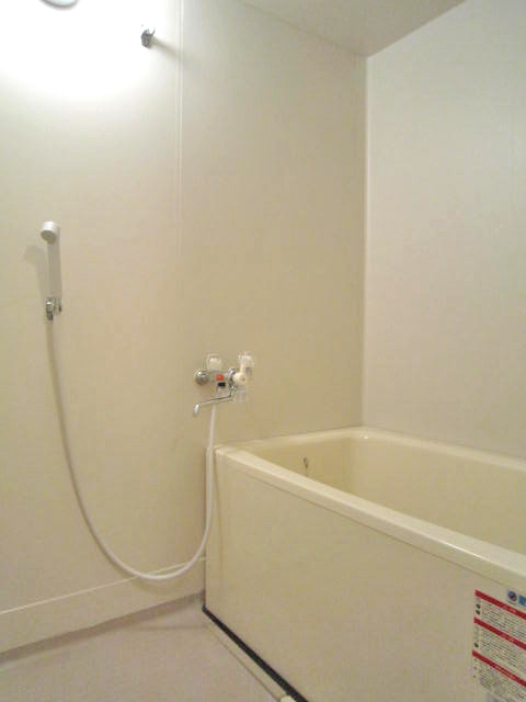 Bath. It is a photograph of another room of the same type