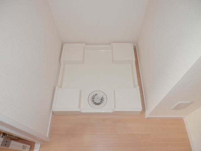 Other room space. Washing machine in the room