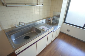 Kitchen. There is a window bright kitchen storage is also rich