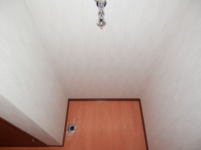 Other room space. Washing machine in the room