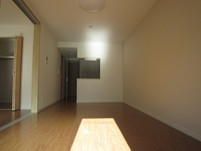 Living and room. It has adopted counter kitchen