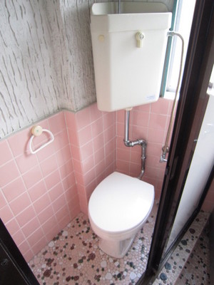 Toilet. There is a window in the toilet