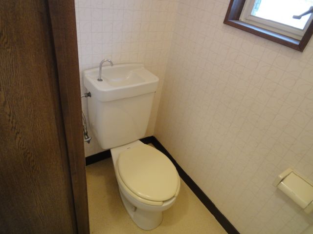 Toilet. There is a window in the toilet