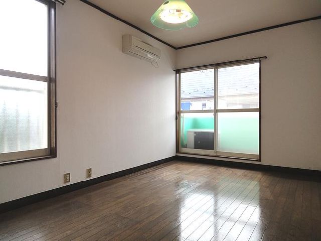 Living and room. It is a corner room.