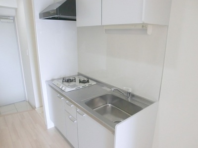 Kitchen. It is a kitchen with a shelf and hanging two-burner gas stove.