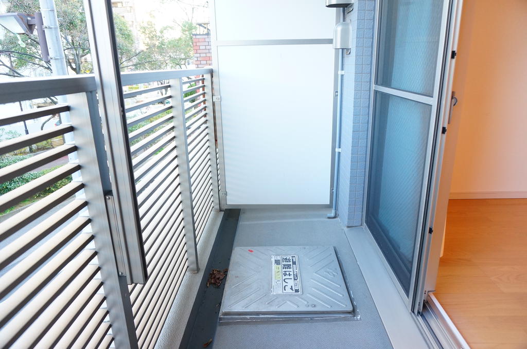 Balcony. It is a quiet green road in front of