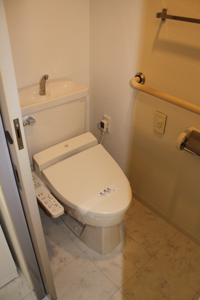 Toilet. Warm water washing toilet seat equipped
